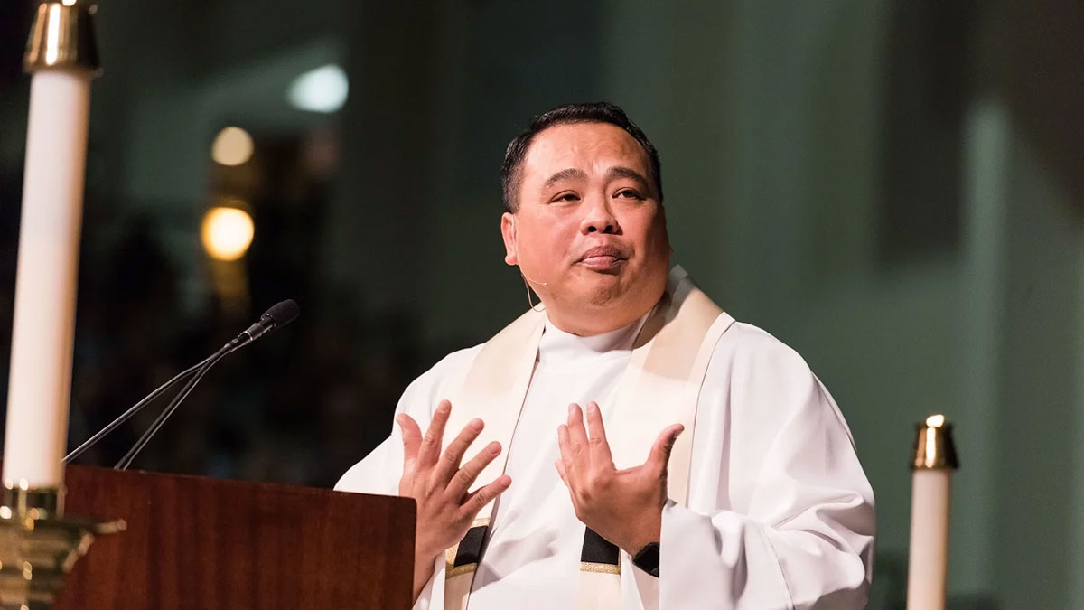 Father Paul Vu SJ delivering the homily