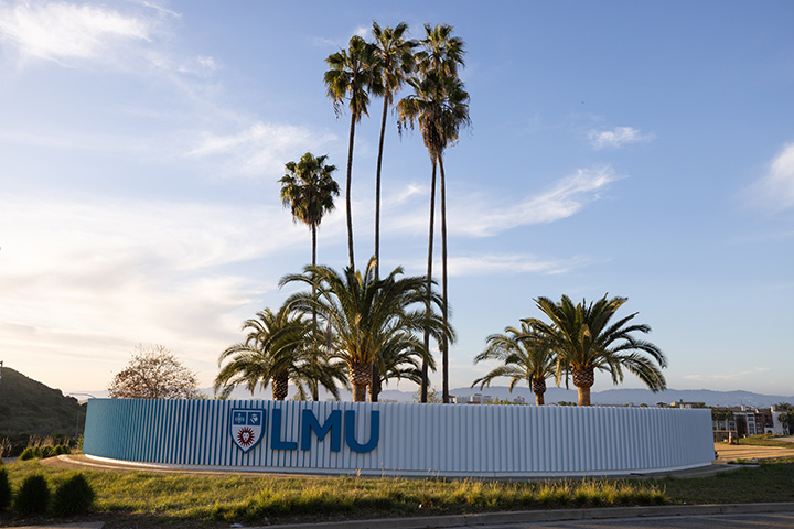 Lincoln Blvd Entryway wall with LMU letters in front of palm trees